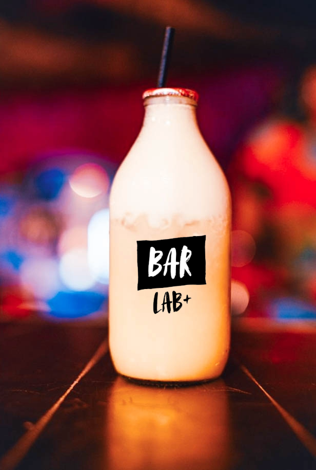 Shaking cocktails during in-person mixology masterclass